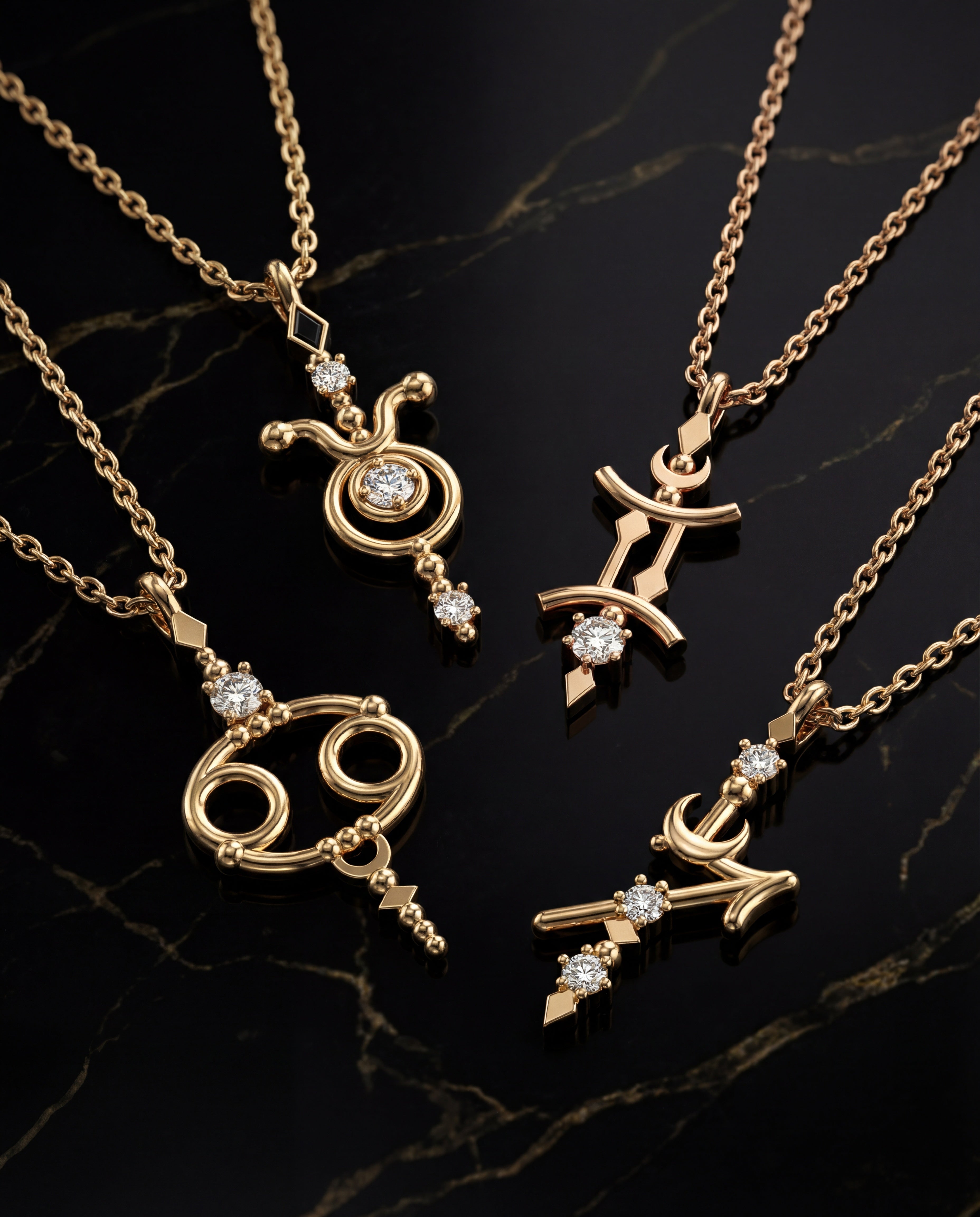 Luxury 14K yellow gold zodiac pendant necklaces with diamond accents displayed on black marble background