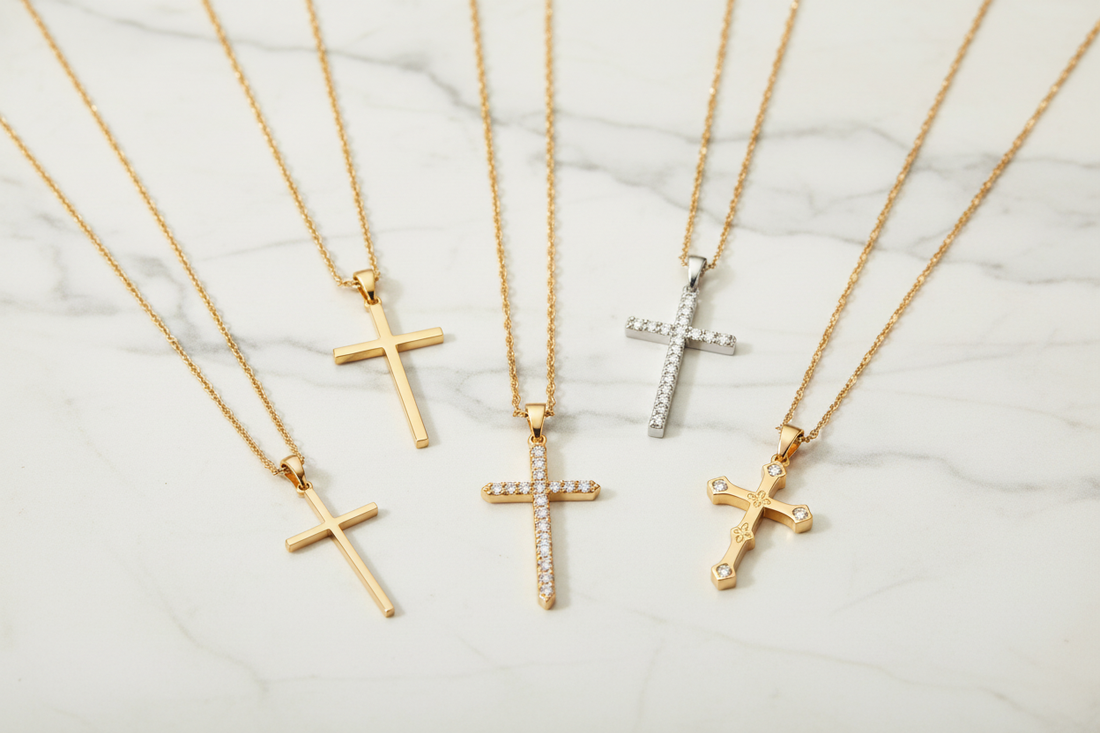 Collection of 7 handcrafted cross necklaces in 14K gold including minimal, pavé diamond, guardian, and black enamel designs made in NYC