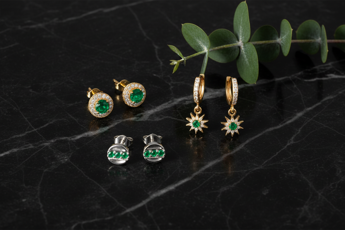 Zirelle Emerald Halo Studs, Helion Starburst Hoop Earrings, and Tauren Line Studs in 14K Gold — May Birthstone Earrings by Black Pearl of Queens