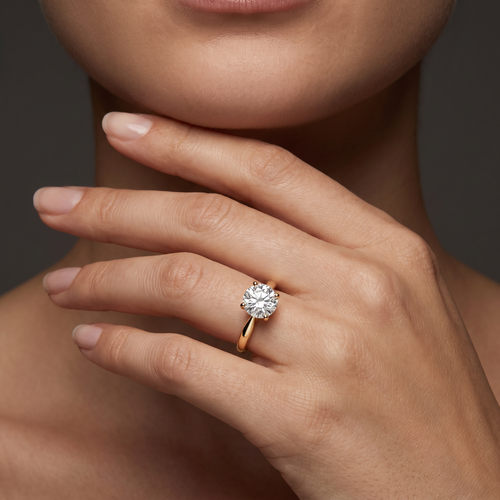 1.5ct cathedral solitaire engagement ring in 14K gold worn on hand