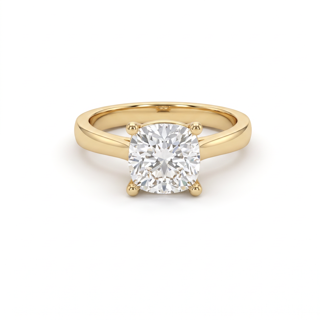 1.5ct cushion cut diamond solitaire in 14K yellow gold, front view, four-prong head on a 2.5mm shank