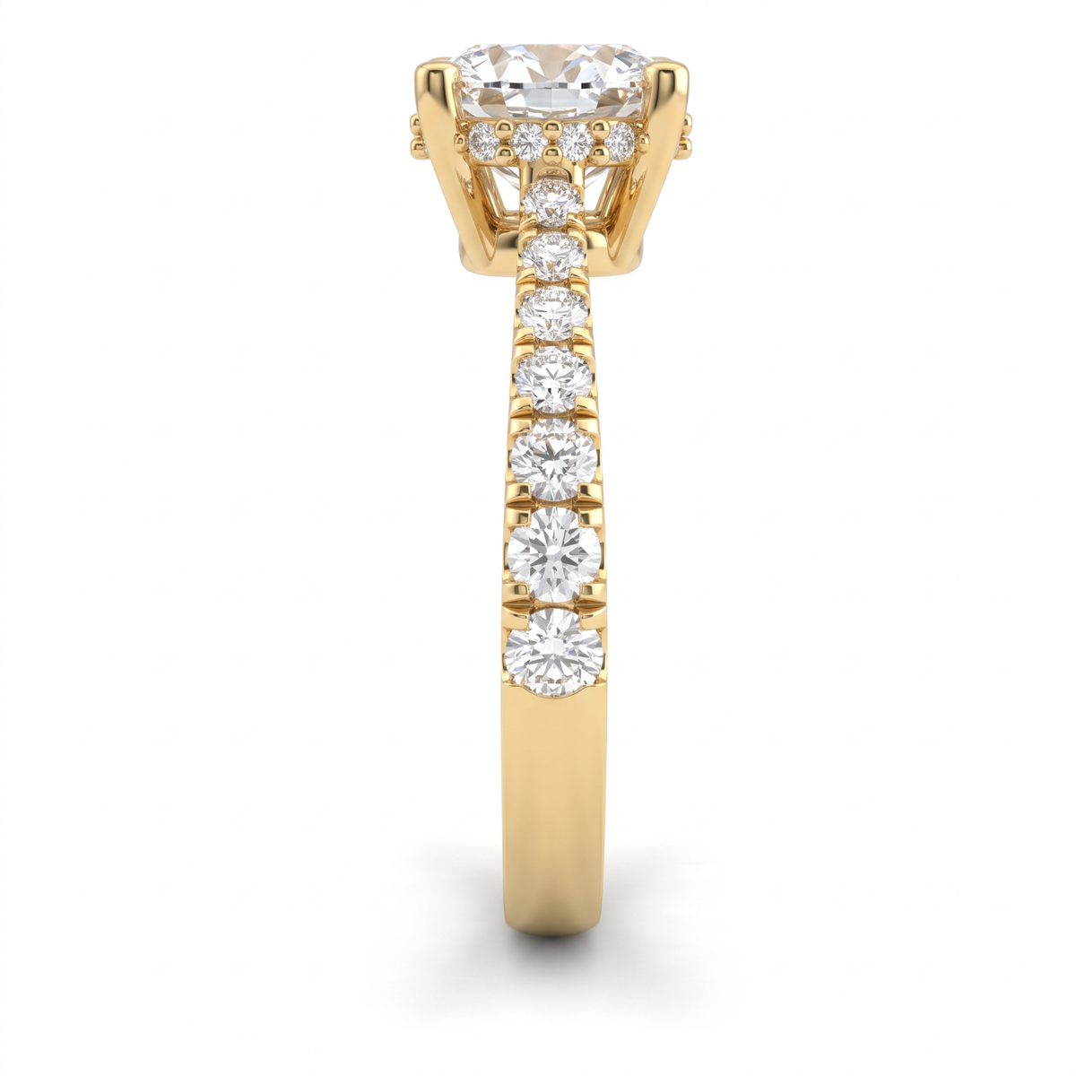 Side view of a 1.5ct cushion engagement ring in 14K yellow gold with graduated pavé Lab-Grown Diamond band and hidden halo basket
