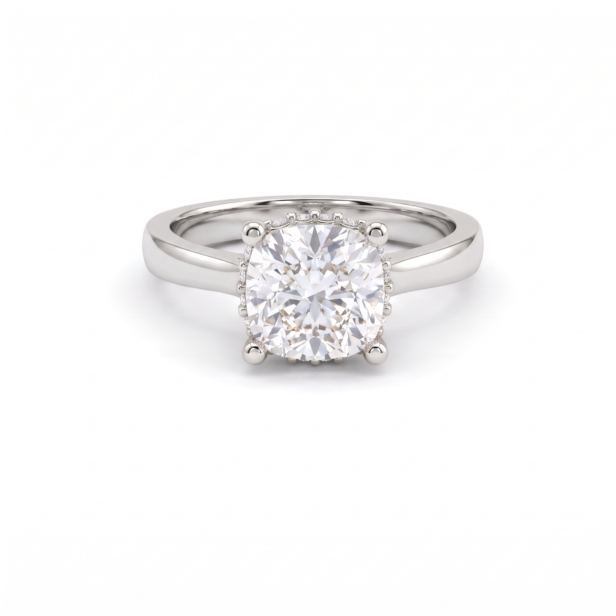 1.5ct cushion cut diamond with hidden halo in 14K white gold, front view, four-prong head on a 2.5mm shank
