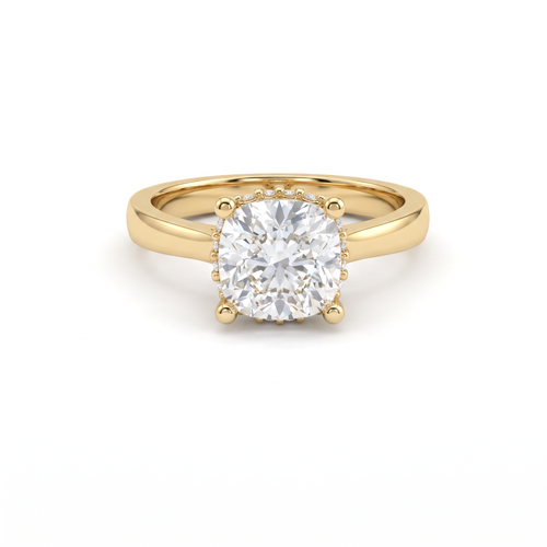 1.5ct cushion cut diamond with hidden halo in 14K yellow gold, front view, four-prong head on a 2.5mm shank