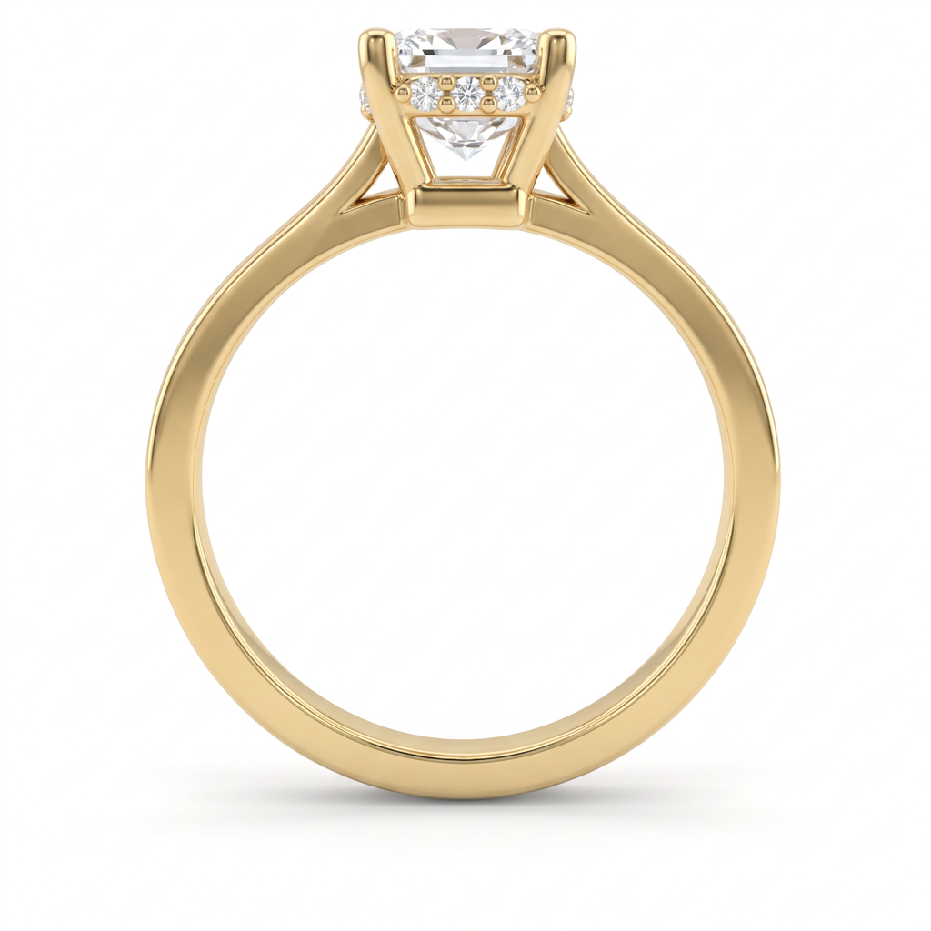Profile of a 1.5ct emerald cut hidden halo engagement ring in 14K yellow gold, four-prong setting