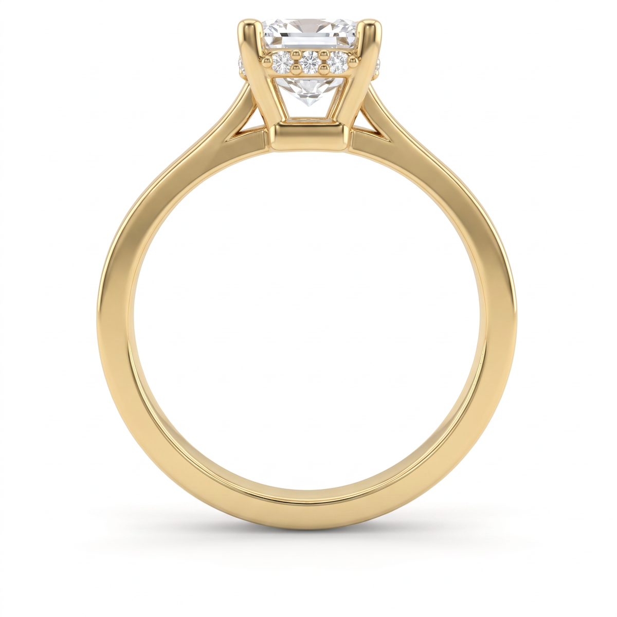 Profile of a 1.5ct emerald cut hidden halo engagement ring in 14K yellow gold, four-prong setting