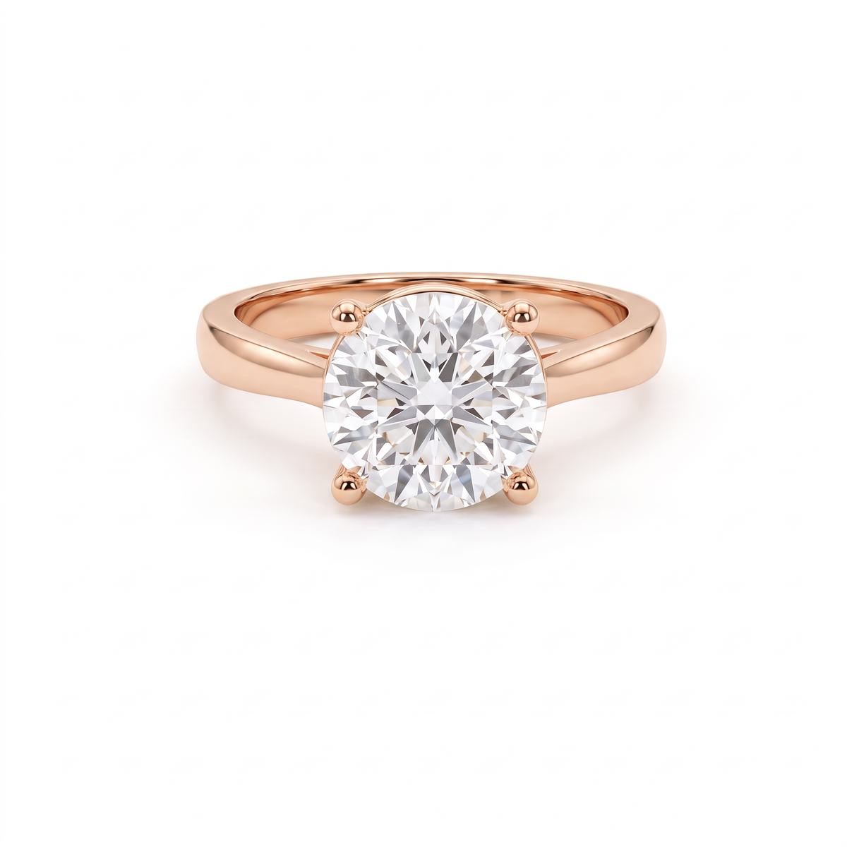 1.5ct round brilliant diamond solitaire in 14K rose gold, front view, four-prong head on a 2.5mm shank