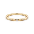 1.5mm star-set Lab-Grown Diamond band in 14K yellow gold, twelve flush-set diamonds, front view