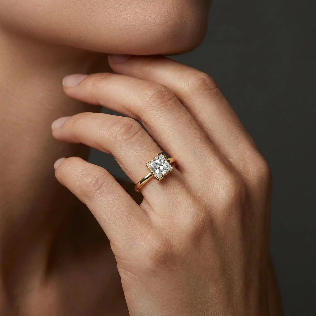 Woman wearing 1 Carat Princess Cut Floating Hidden Halo Diamond Ring in 14K yellow gold