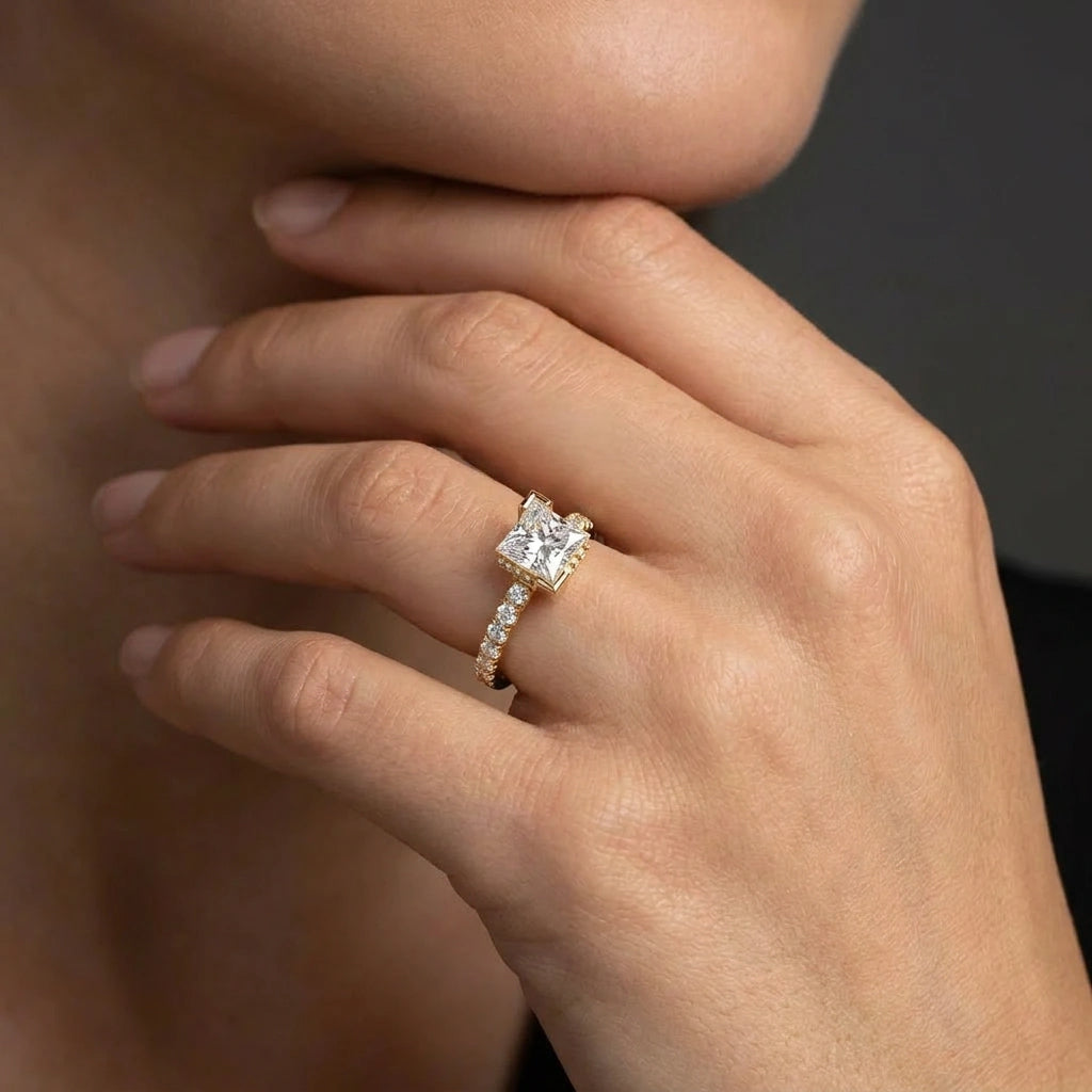 Woman wearing 1 Carat Princess Cut Pavé Floating Hidden Halo Diamond Ring in yellow gold