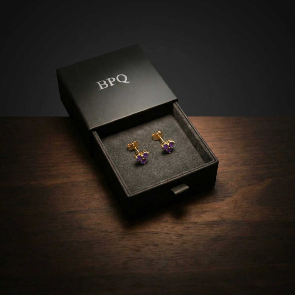 14K gold stud earrings presented in Black Pearl of Queens signature matte black jewelry box