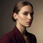 Woman wearing 14K gold purple gemstone stud earrings styled in refined luxury portrait
