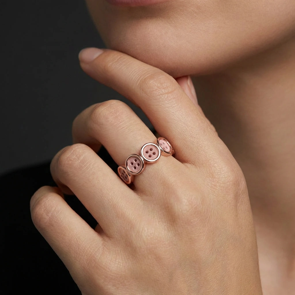 14K rose gold multi disc button design ring worn on hand close-up