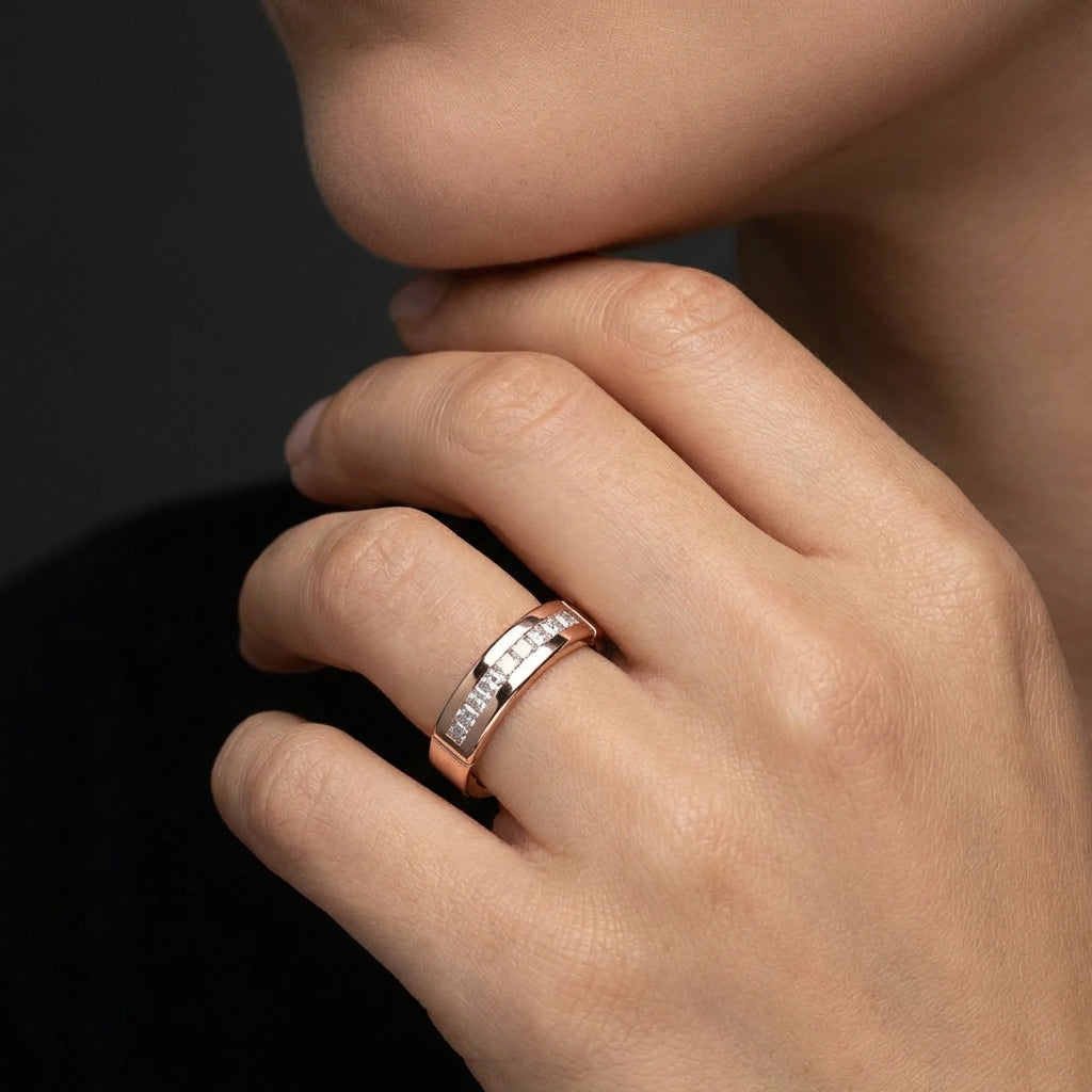 Close-up of 14K gold men’s diamond wedding band with square-set diamonds