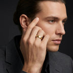Man wearing 5mm brushed 14K yellow gold low dome wedding ring - lifestyle shot