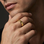 Close-up of 14K yellow gold men’s wedding band on hand