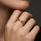 14K yellow gold polished twist band ring close-up on model
