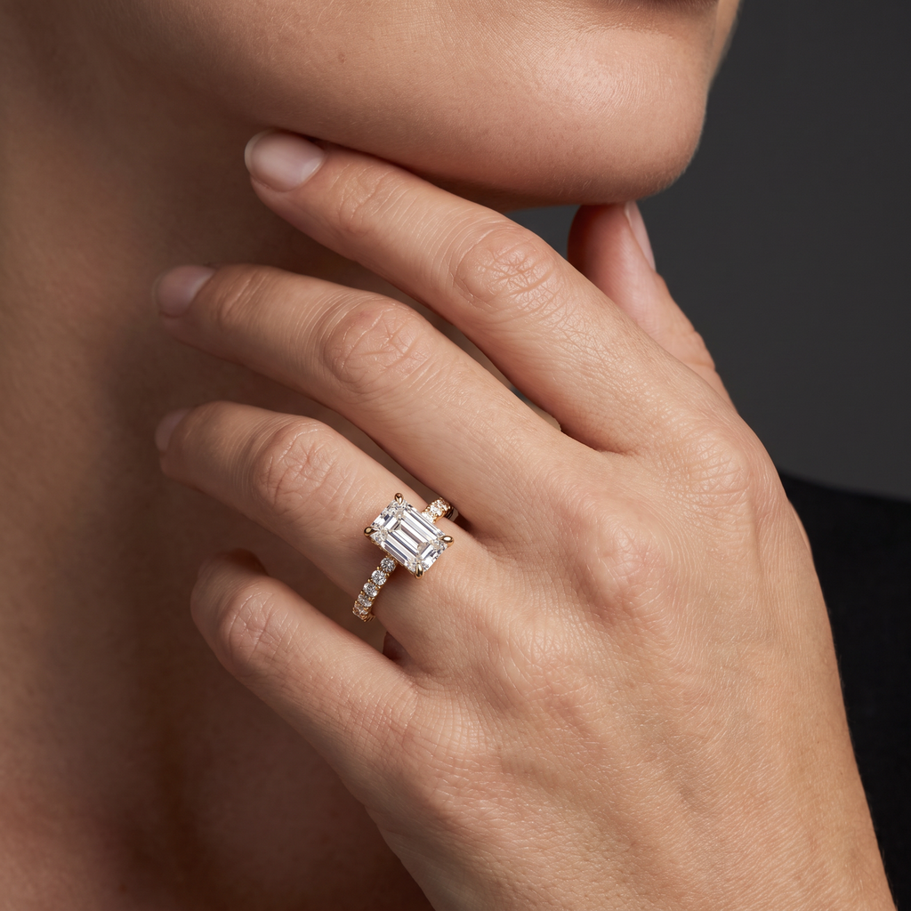1ct emerald cut French pave engagement ring in 14K gold worn on hand