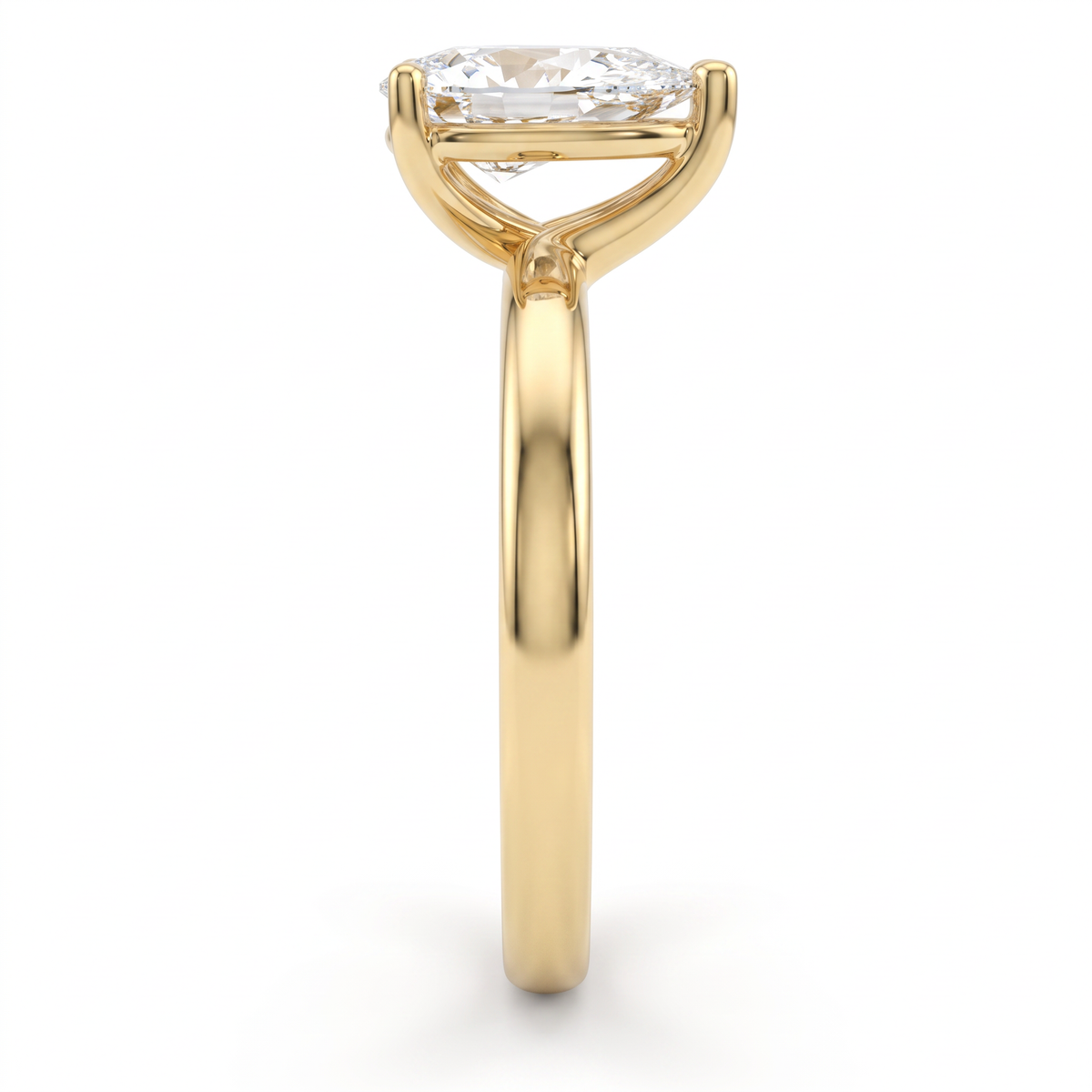 Side profile of 1ct pear solitaire engagement ring in 14K yellow gold showing setting height and open basket