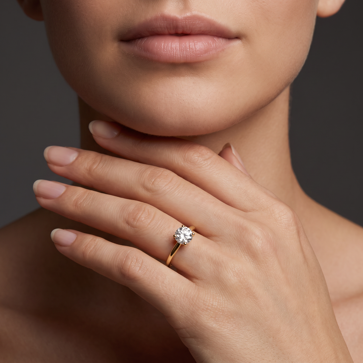 1ct round Lab-Grown Diamond solitaire engagement ring in 14K yellow gold worn on hand
