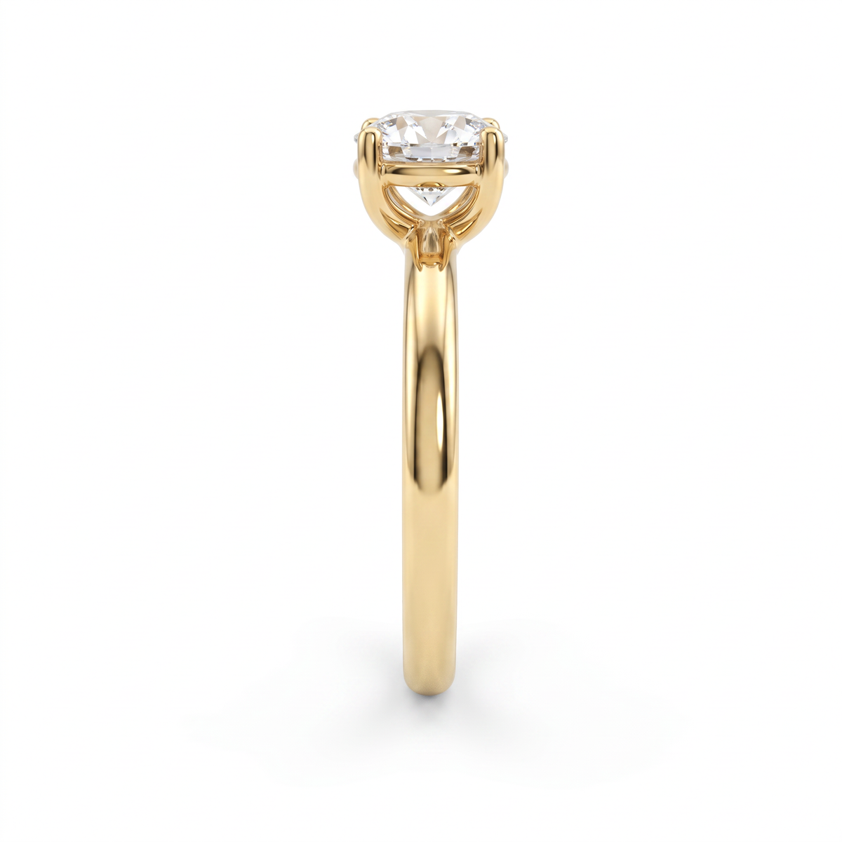 Side profile of 1ct round solitaire engagement ring in 14K yellow gold showing low setting height and rounded band