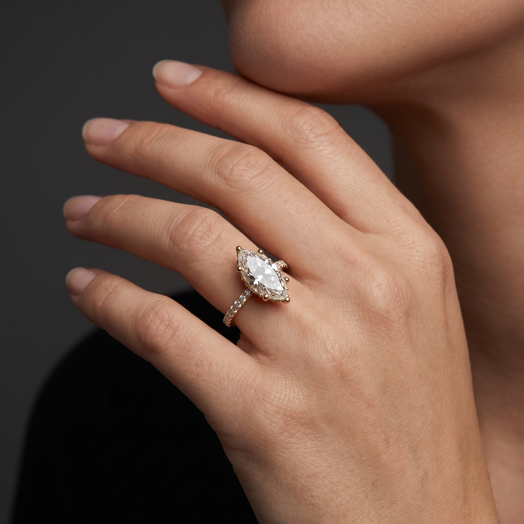 2.5 carat marquise cut Lab-Grown Diamond engagement ring worn on hand, 14K rose gold with pavé band, shown for scale