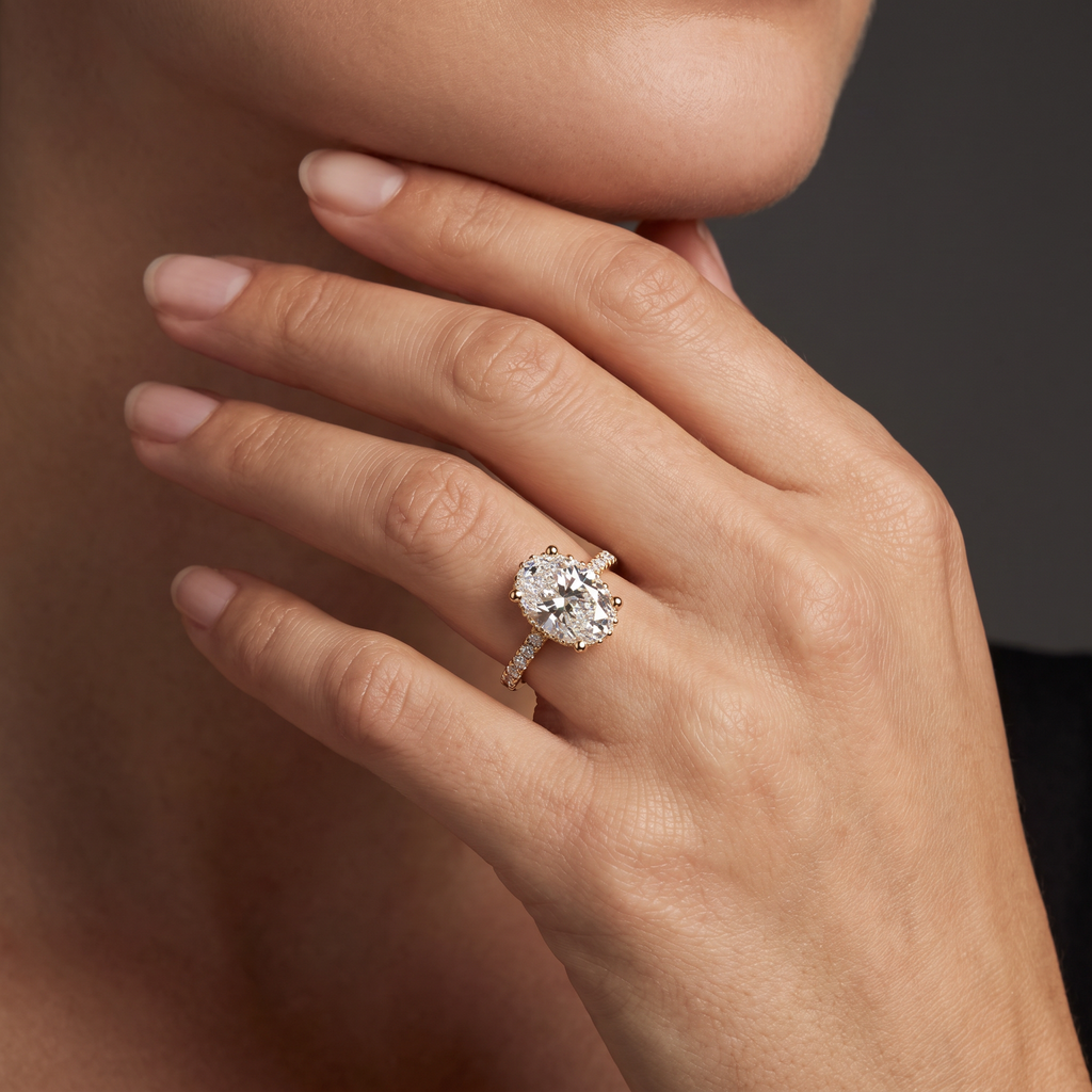 2.5 carat oval Lab-Grown Diamond engagement ring worn on hand, 14K rose gold with pavé band, shown for scale