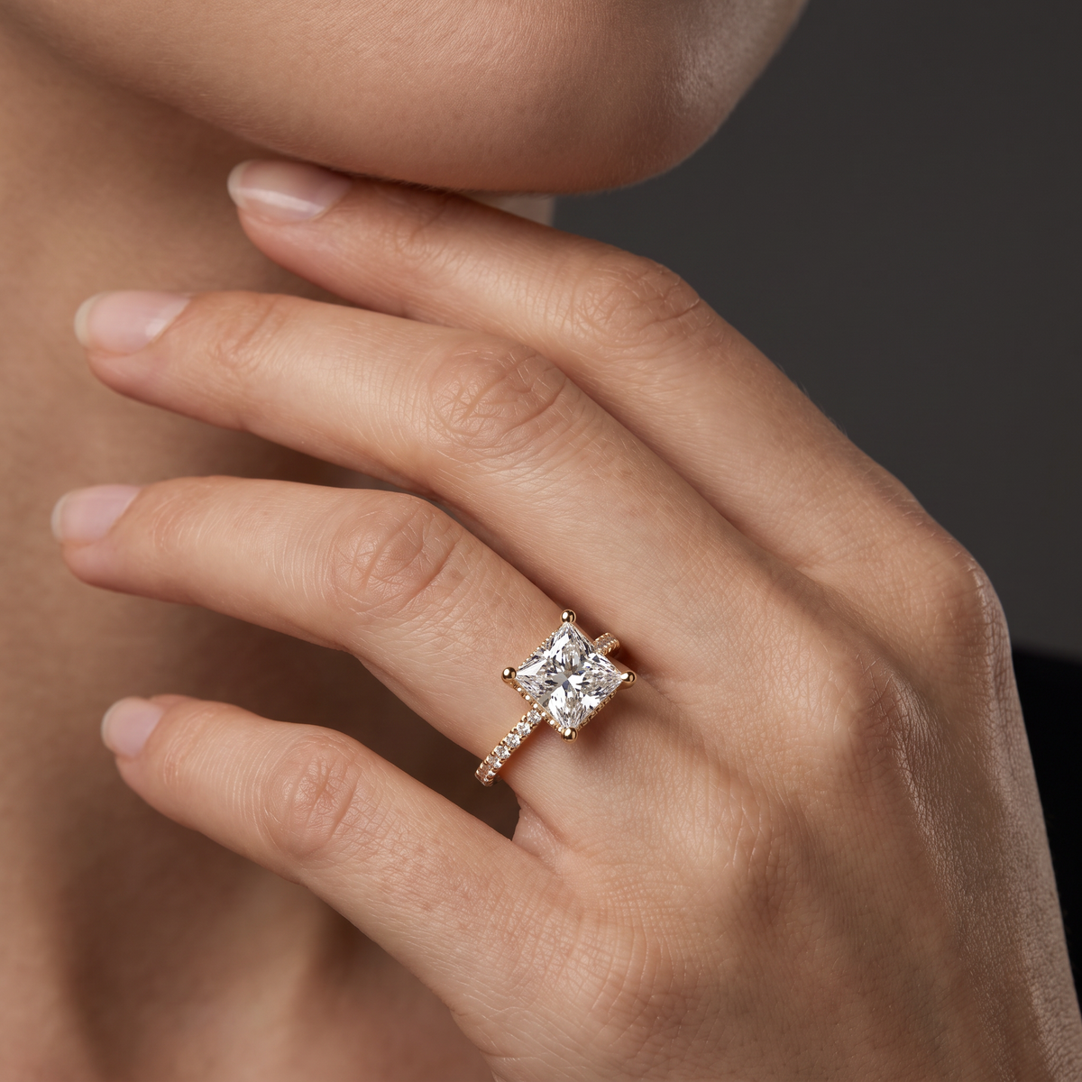 2.5 carat princess cut Lab-Grown Diamond engagement ring worn on hand, 14K rose gold with pavé band, shown for scale