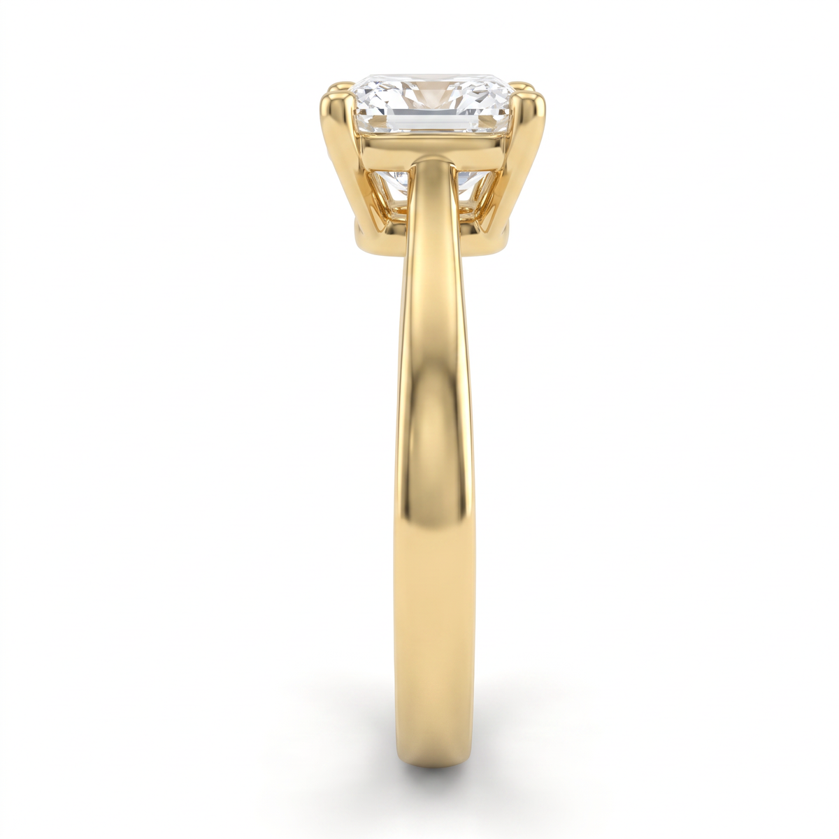 2.5ct cushion cut solitaire in 14K yellow gold viewed along the 2.5mm shank, basket and gallery visible from the side