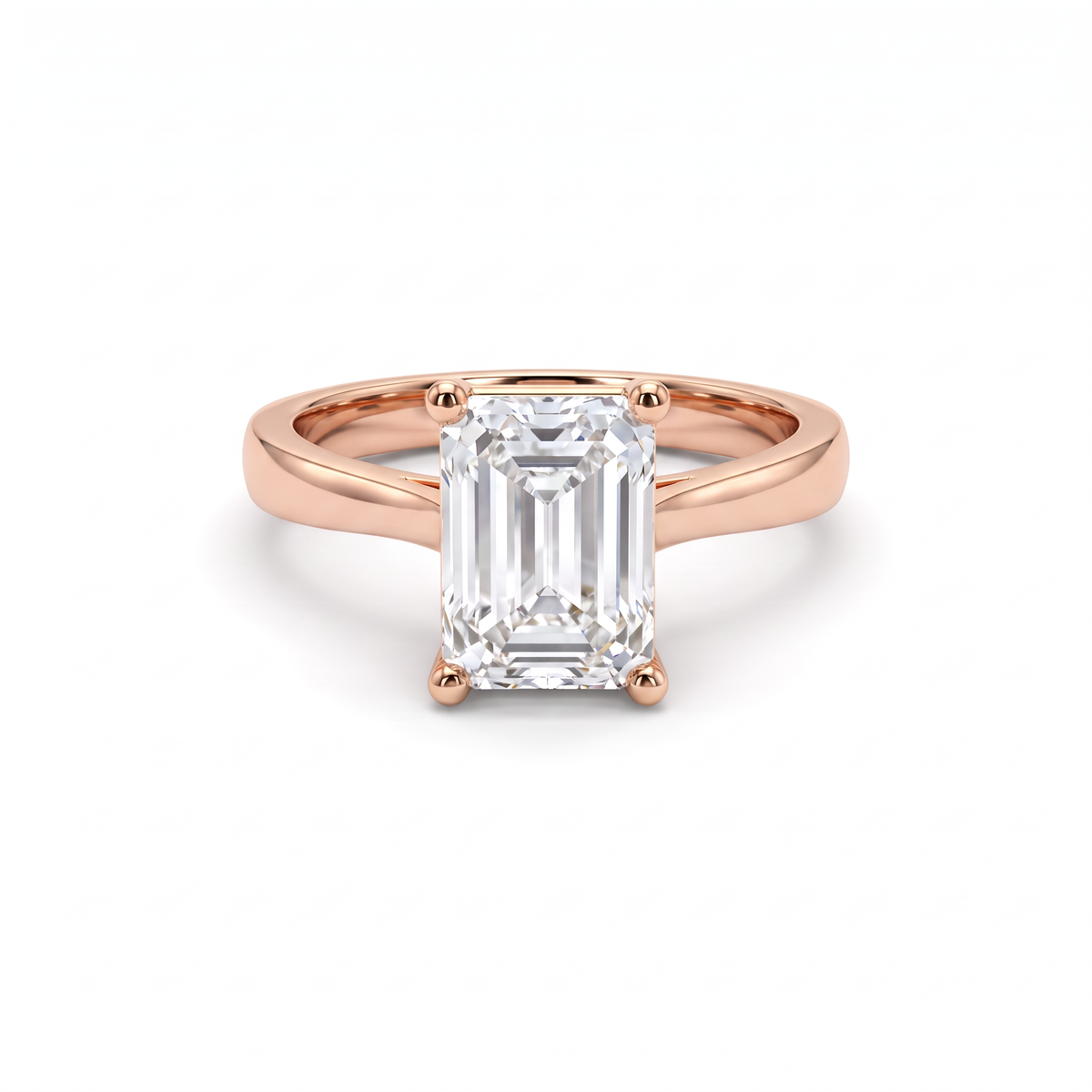 2.5ct emerald cut diamond solitaire in 14K rose gold, front view, four-prong head on a 2.5mm shank