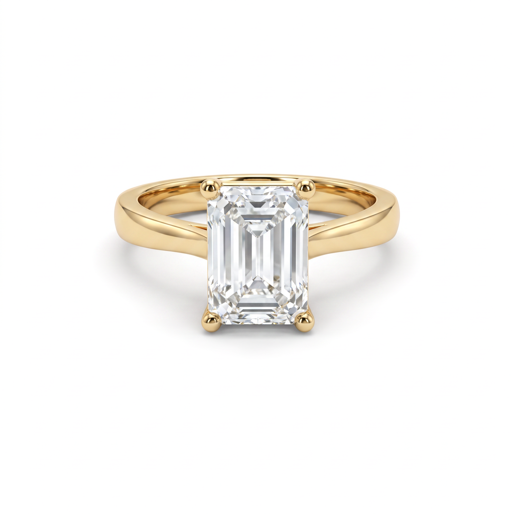 2.5ct emerald cut diamond solitaire in 14K yellow gold, front view, four-prong head on a 2.5mm shank