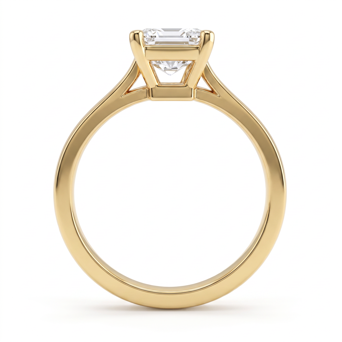 Side profile of the 2.5ct emerald cut solitaire in 14K yellow gold, showing the second gallery beneath the basket