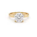 2.5ct round brilliant diamond solitaire in 14K yellow gold, front view, four-prong head on a 2.5mm shank