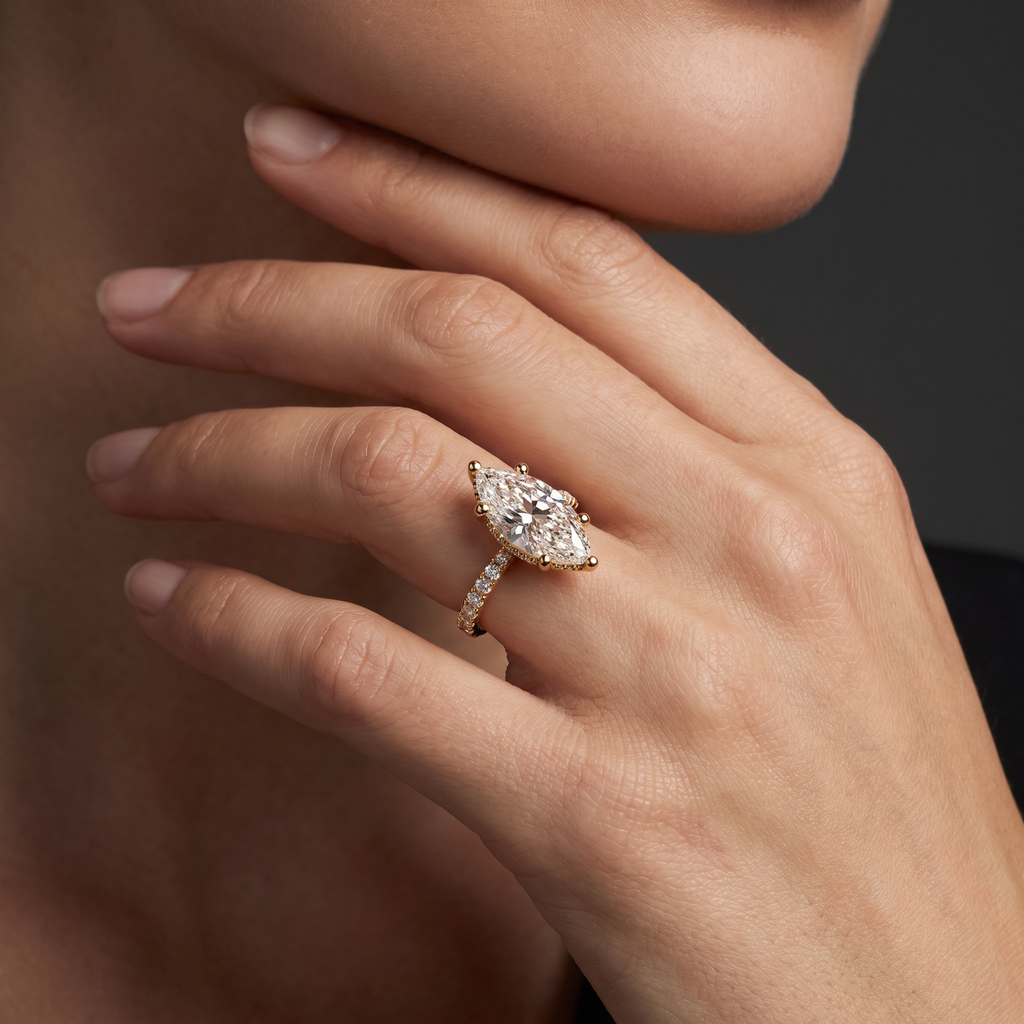2 carat marquise cut Lab-Grown Diamond engagement ring worn on hand, 14K rose gold with pavé band, shown for scale