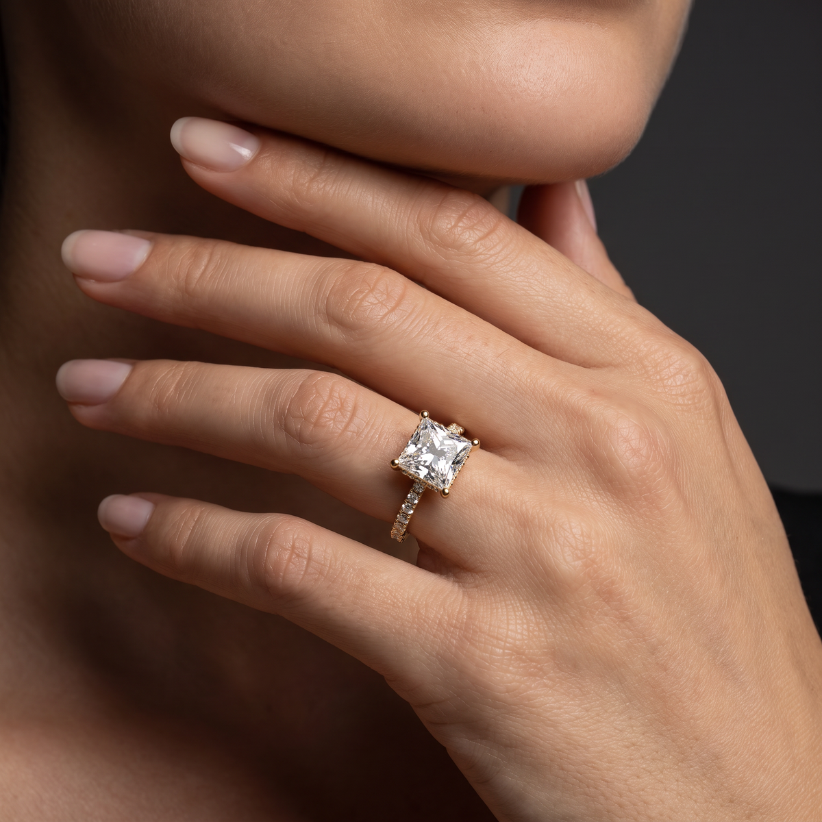 2 carat princess cut Lab-Grown Diamond engagement ring worn on hand, 14K rose gold with pavé band, shown for scale