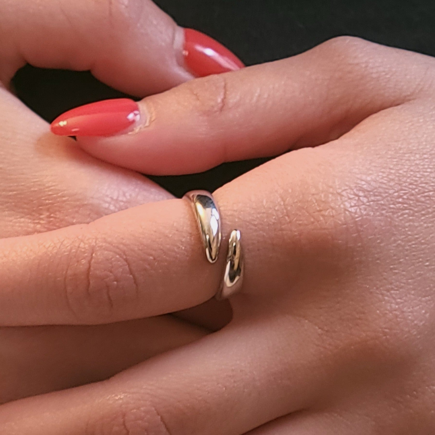 White gold stand alone ring on hand
