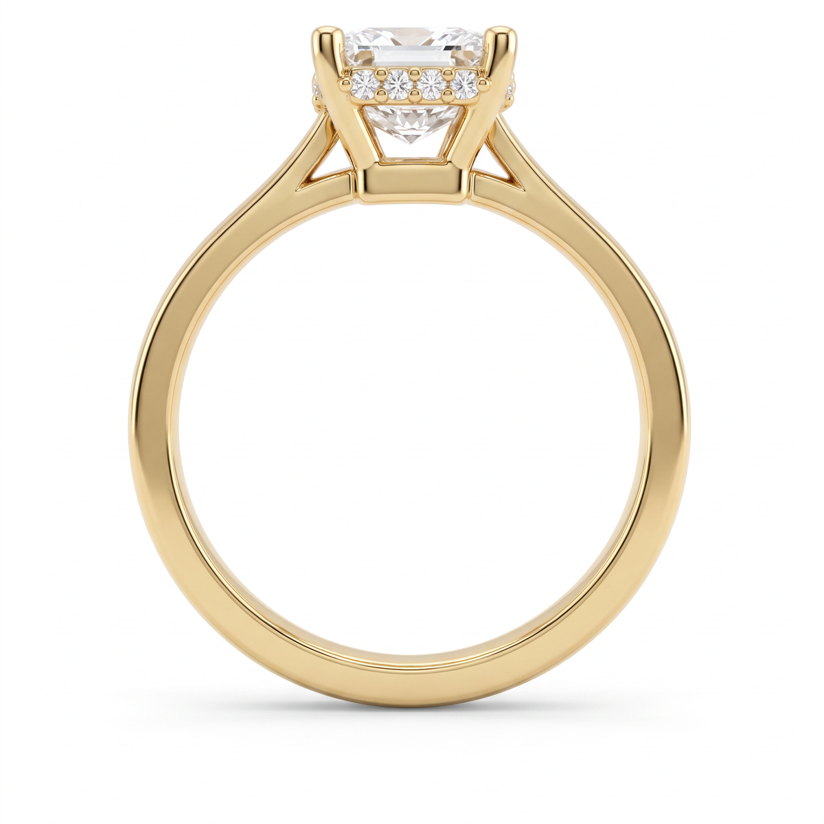 Profile of a 2ct emerald cut hidden halo engagement ring in 14K yellow gold, four-prong setting