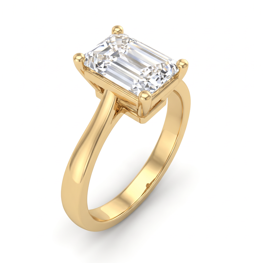 Three-quarter view of the 2ct emerald cut solitaire in 14K yellow gold, corner prongs and gallery visible