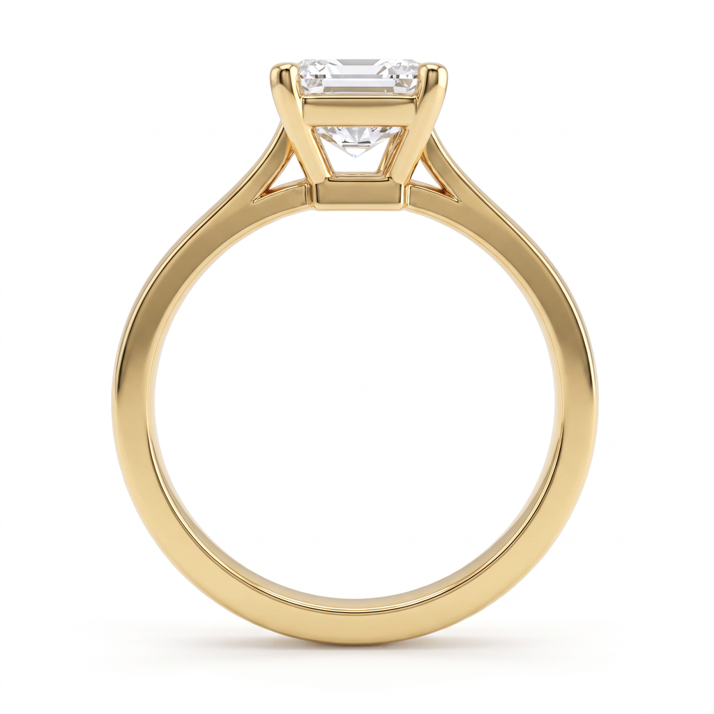 Side profile of the 2ct emerald cut solitaire in 14K yellow gold, showing the second gallery beneath the basket