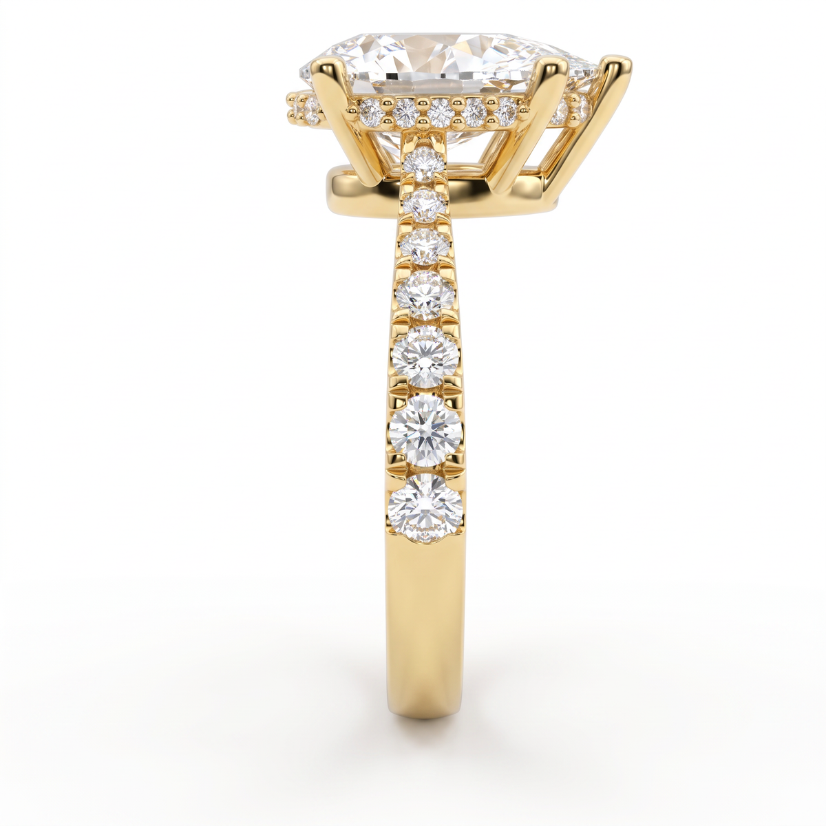 Close-up of the hidden halo and pavé shoulders on a 14K yellow gold 2ct Pear Cut Lab-Grown Diamond engagement ring