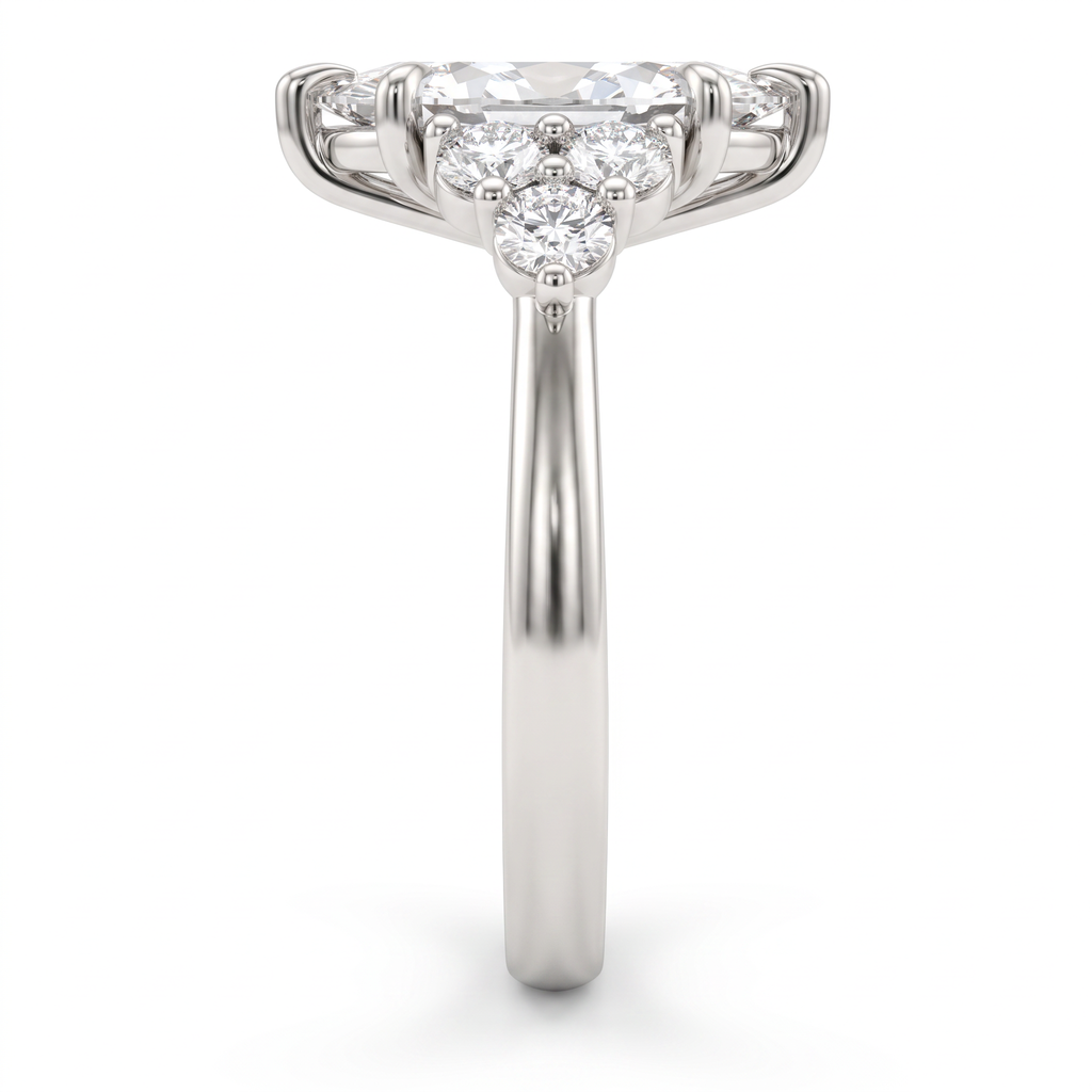 Side profile of a 2ct marquise claw prong engagement ring showing the three-stone round diamond cluster and 14K white gold band
