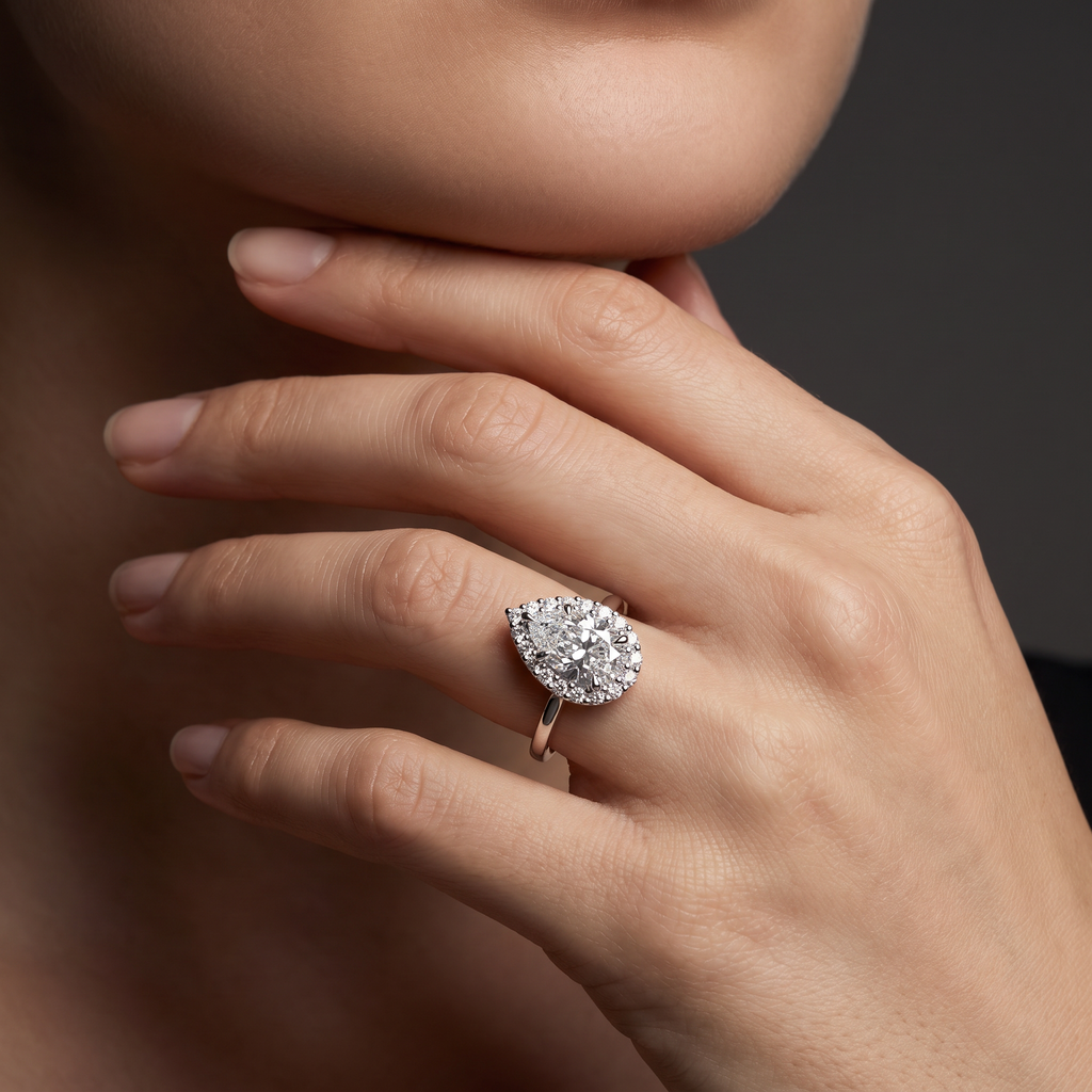 2ct pear cluster halo Lab-Grown Diamond engagement ring worn on hand, 14K white gold
