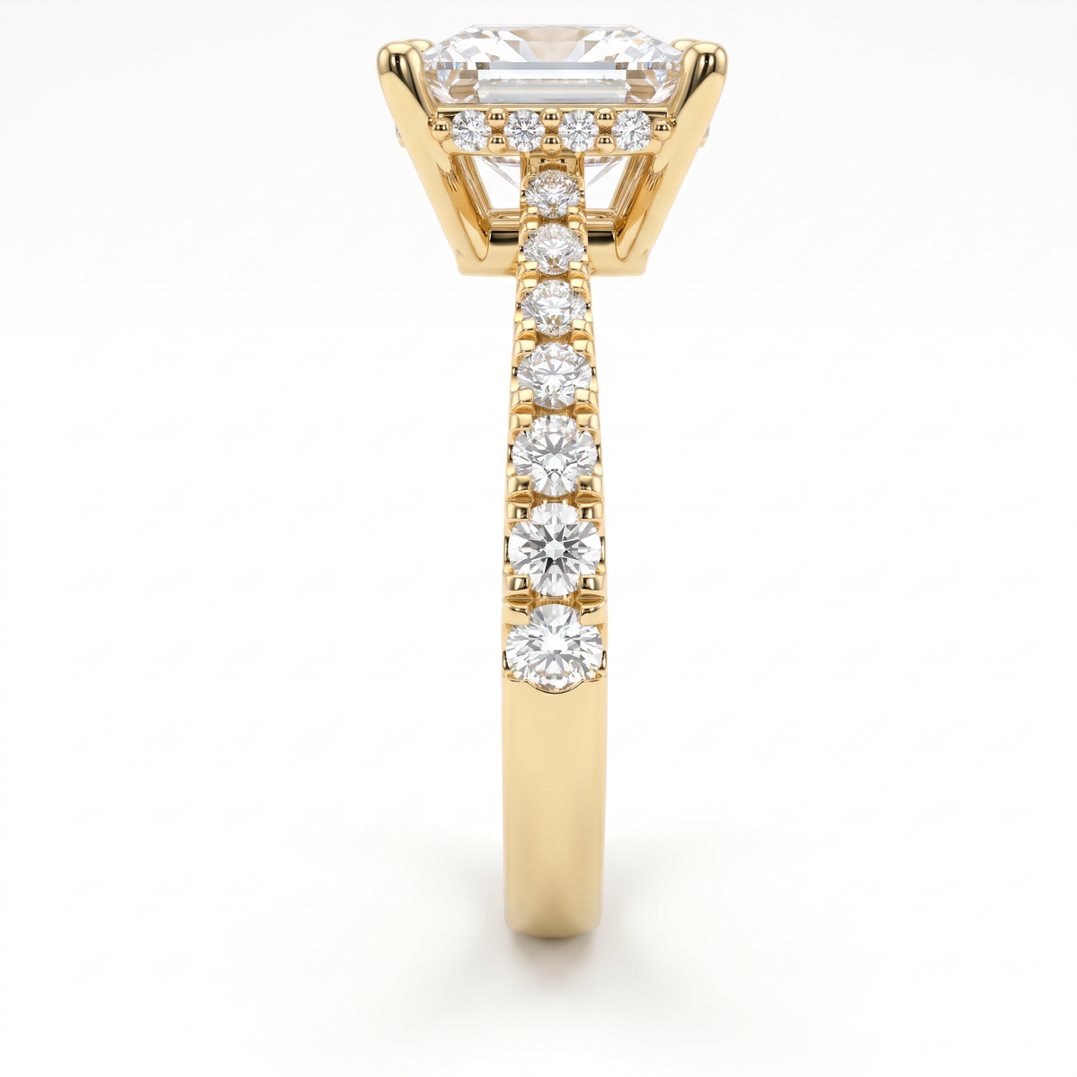 Side view of a 2ct princess engagement ring in 14K yellow gold with graduated pavé Lab-Grown Diamond band and hidden halo basket