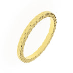 hammered wedding band showing textured surface – angled view