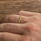 2mm hammered wedding band on mans hand