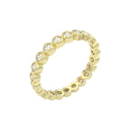 Diamond eternity ring 3mm bezel set in 14k yellow gold, angled view