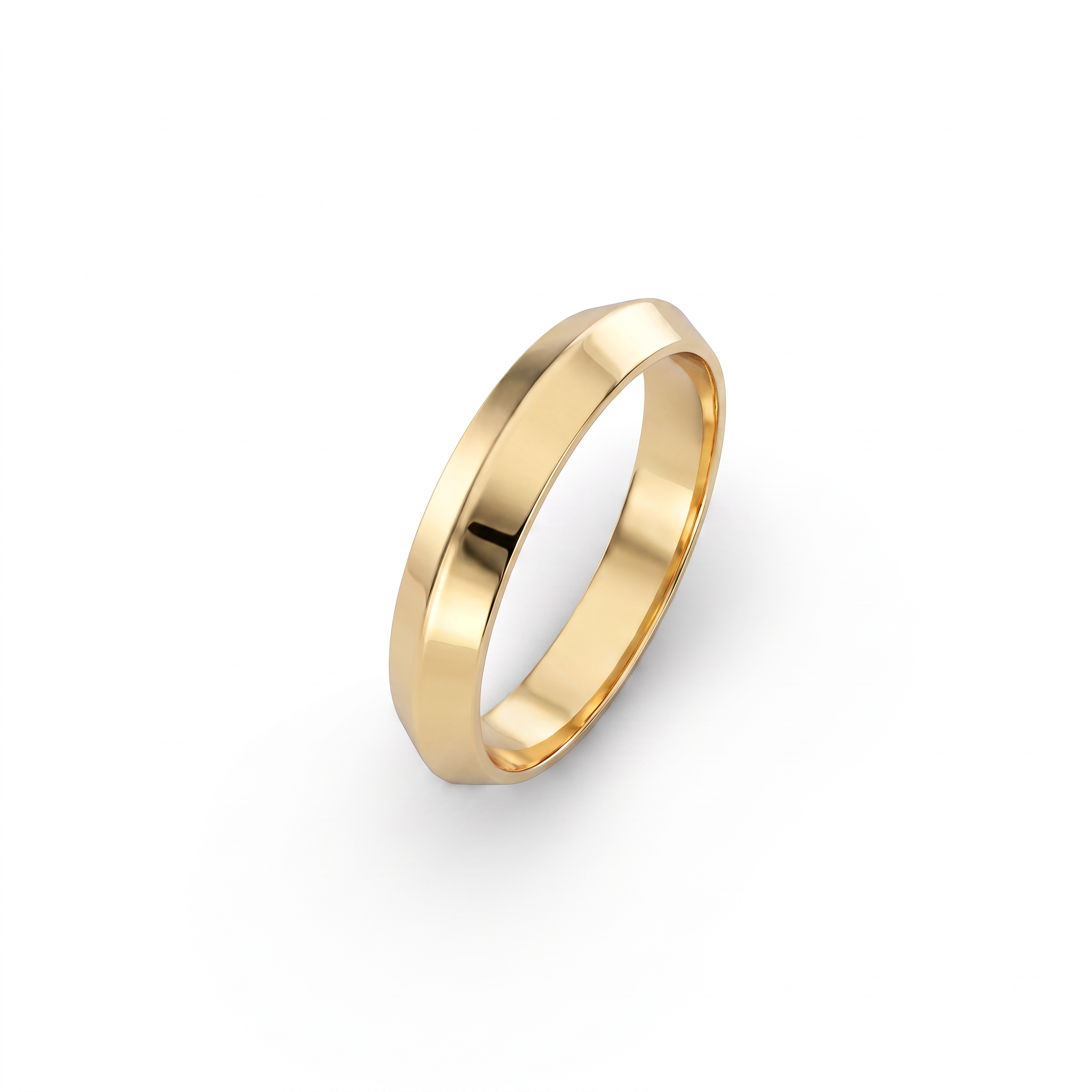 4mm knife-edge wedding band in 14K yellow gold, angled view showing the central ridge and comfort-fit interior