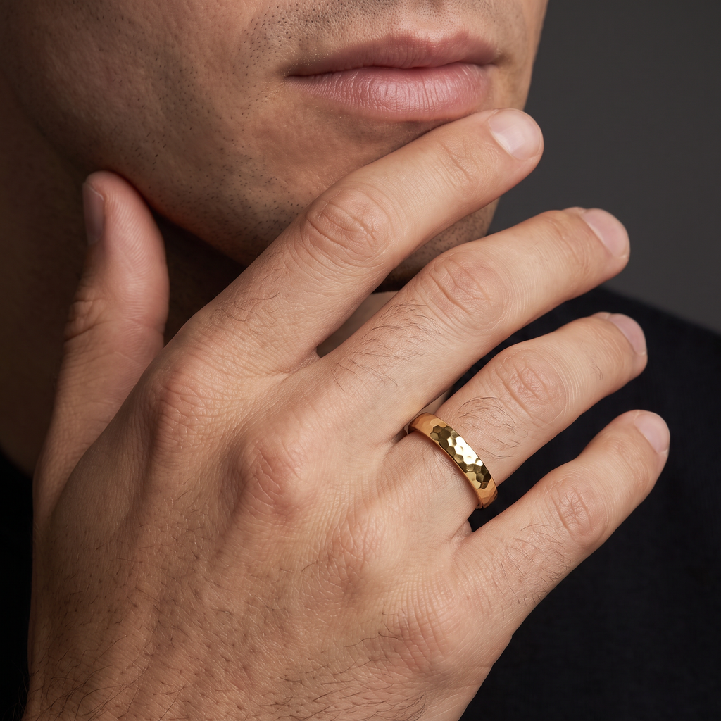 Man wearing the 4mm polished hammered wedding band in 14K yellow gold