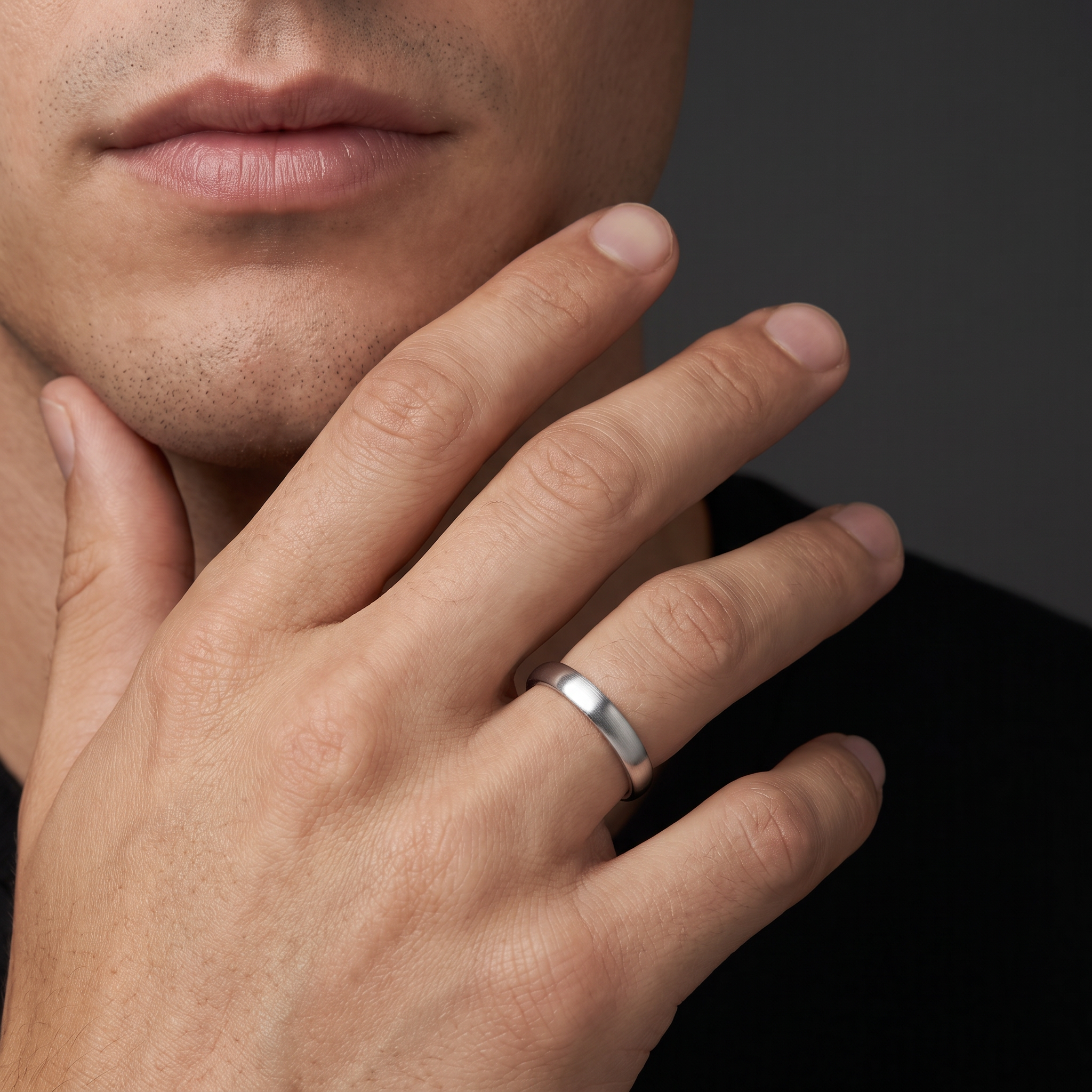 Man wearing the 4mm satin dome wedding band in 14K white gold