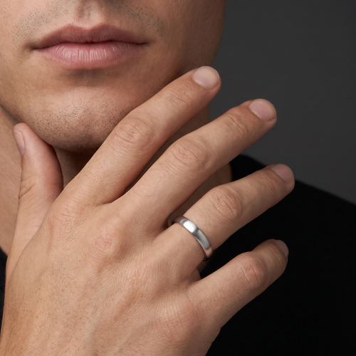 Man wearing the 4mm satin dome wedding band in 14K white gold